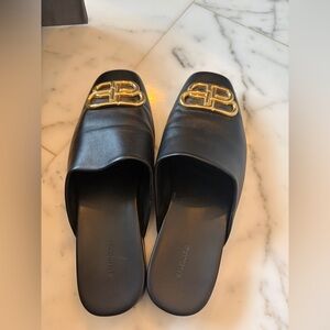 Balenciaga Black Mules with Gold Logo Accent